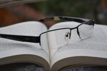 A book and glasses